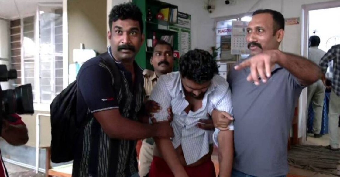 Police take Afan to hospital. Photo: Manorama News