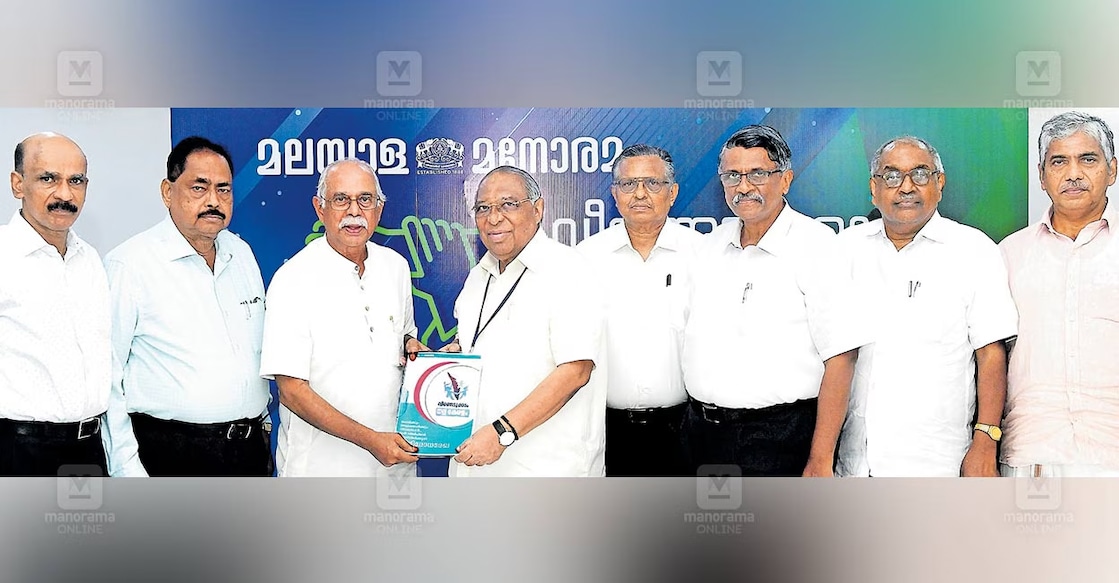 Malayala Manorama Chief Editor Mammen Mathew receives the defence document from former RAW chief P K Hormis Tharakan. Former DGPs A. Hemachandran, K. P. Somarajan, and Jacob Punnoose, along with G. Vijayaraghavan, former member of the State Planning Board and moderator of the discussion, and former DGPs Dr Alexander Jacob and Dr Jacob Thomas are nearby.  
Photo: Manorama