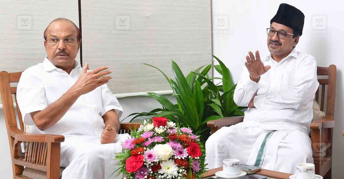 IUML leader P K Kunhalikutty and Panakkad Sadiq Ali Shihab Thangal. Photo: Manorama Online