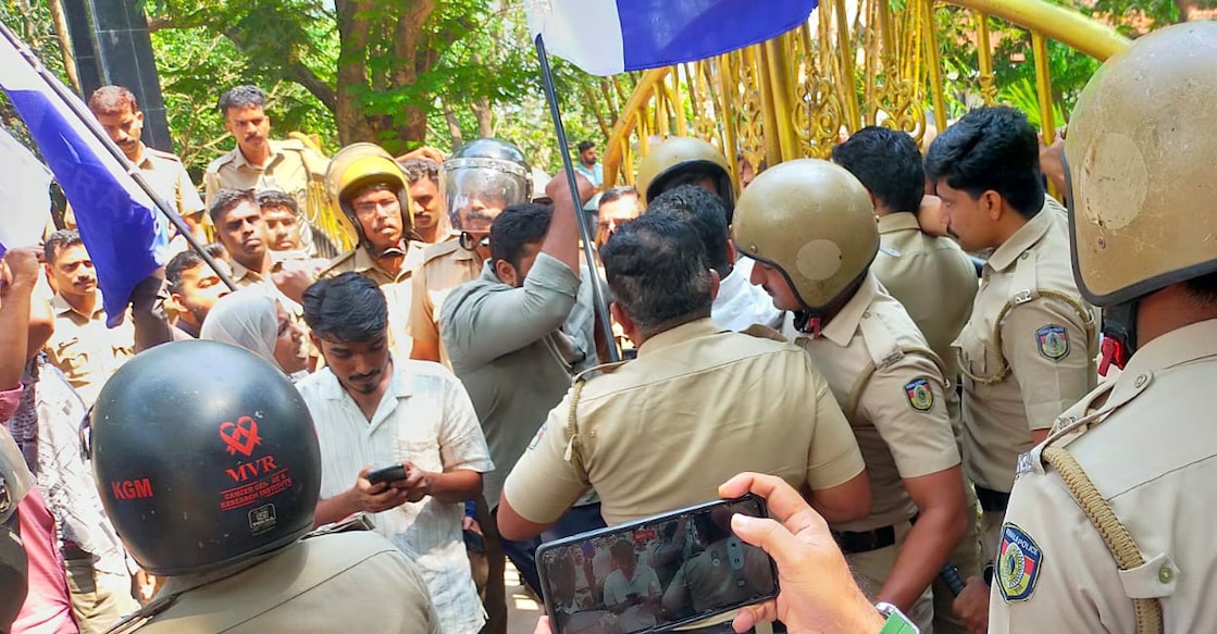 Youth Congress workers gathered outside Dr Shaija’s residence by 7.30 am on Monday to prevent her from assuming office. Photo: Special Arrangement