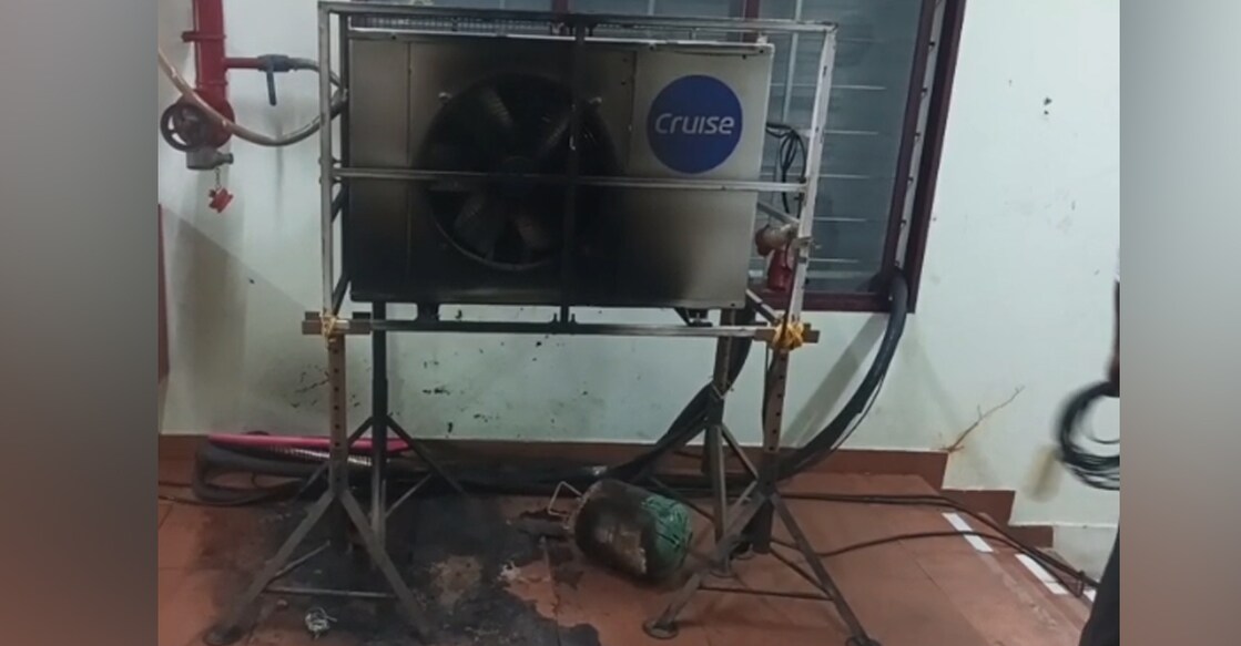 The accused used a gas cylinder to set fire to the AC condenser unit and its connected wiring. Photo: Special Arrangement