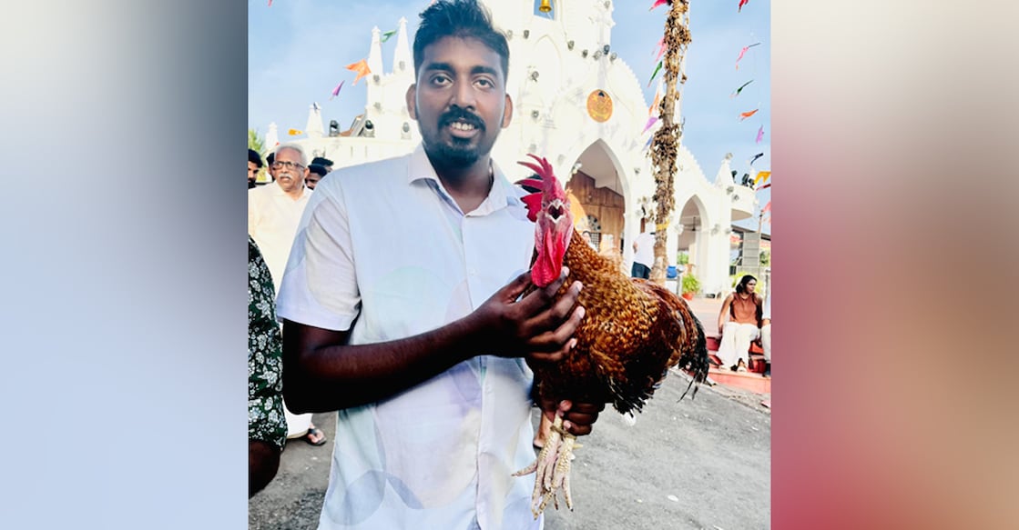 Sony Jacob with the rooster he won for ₹1.25 lakh. Photo: Special Arrangement