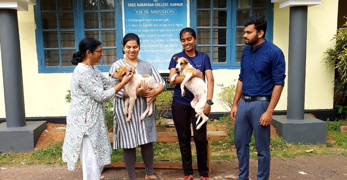 sn-college-kannur-dogs Dr Sushama Prabhu (People for Animal Welfare, Kannur, President), Nithinya R (Assistant Professor, Dept of Zoology), Shivatheertha S (Student) and Dr Sanoop (Veterinary Doctor, District Veterinary Hospital, Kannur) with puppies at SN College, Kannur. Photo: Special arrangement.