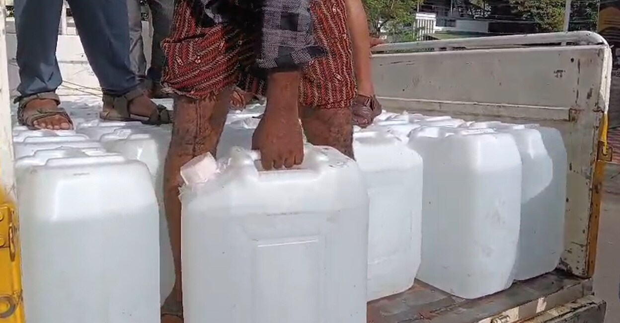 A screengrab showing the seized spirit being unloaded from the pickup van. 