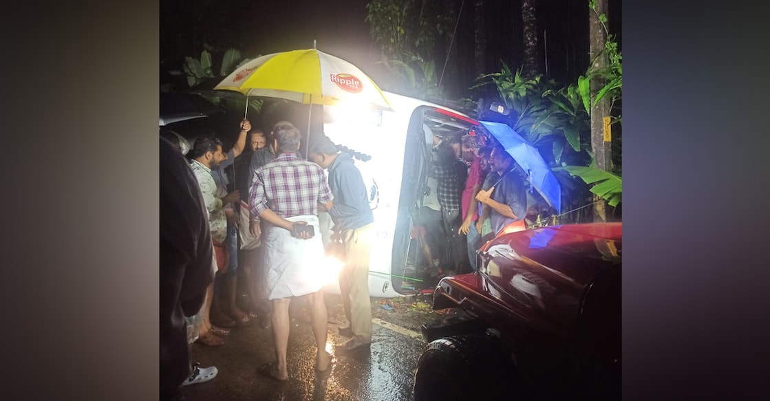 mini-bus-accident-idukki Police and locals near the bus involved in the accident. Photo: Special arrangement