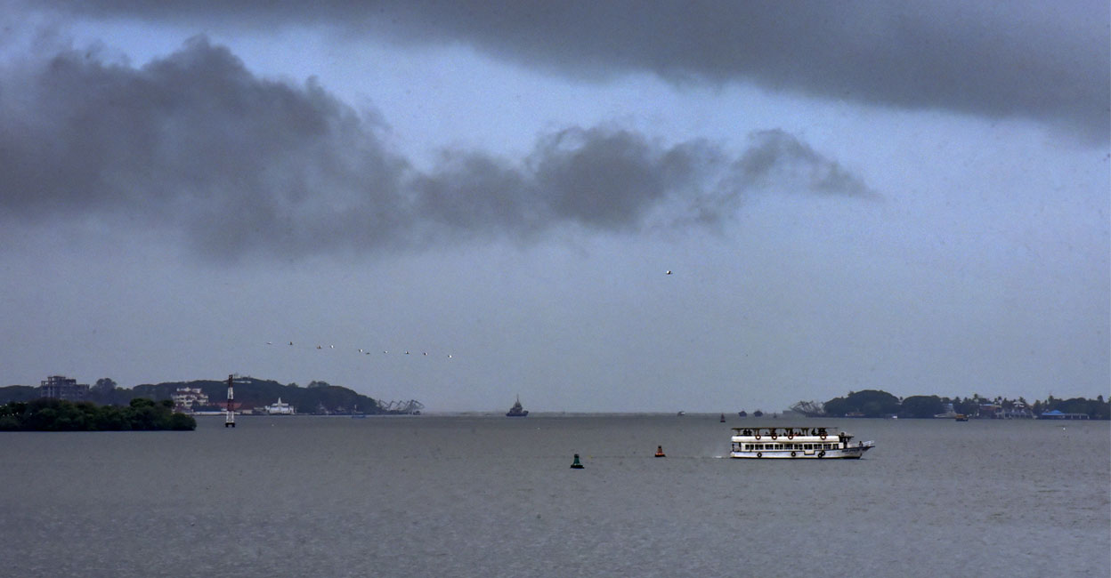Dark clouds cover the skyline in Kochi. Photo: PTI