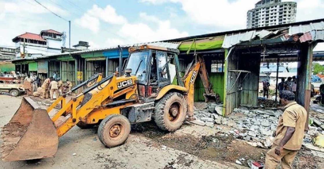 aluva-old-market-02-c The structures in Aluva old market being demolished by a bulldozer. Photo: Manorama