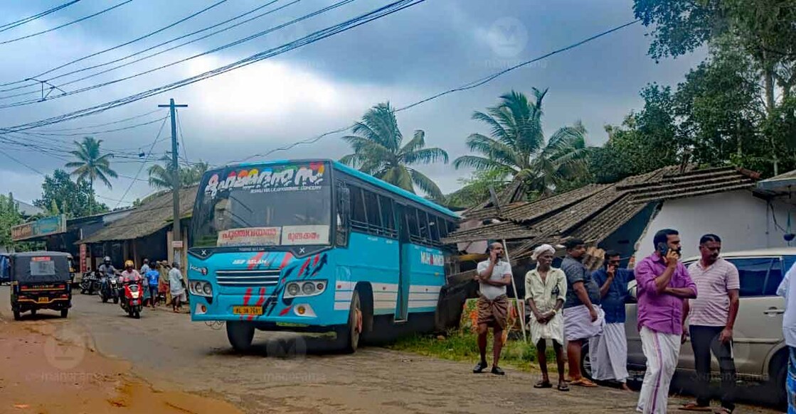 The bus stopped after crashing into a shop and house after its brake failed. Photo: Manorama