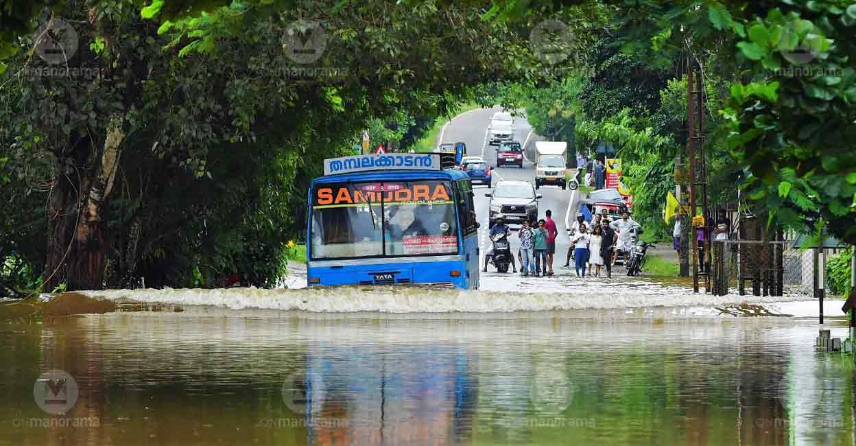 A bus navigates through a waterlogged road in Kottayam. Photo: Manorama