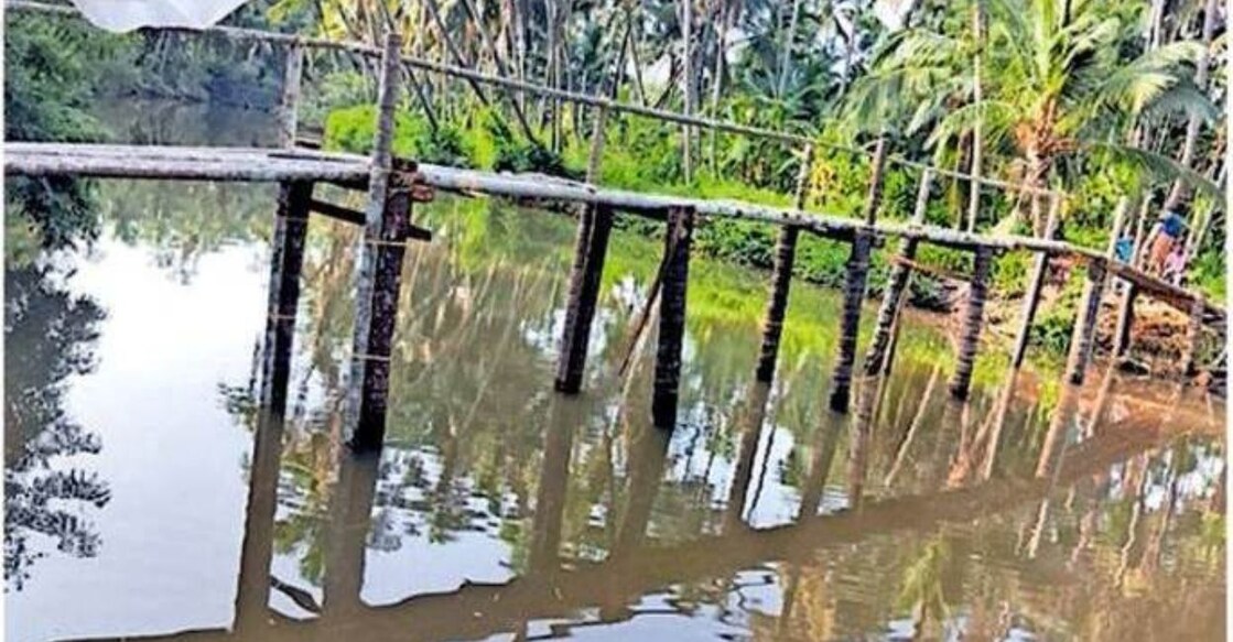  A pedestrian bridge being built by locals across the river to connect Mayicha and Vengatt. Photo: Special Arrangement 