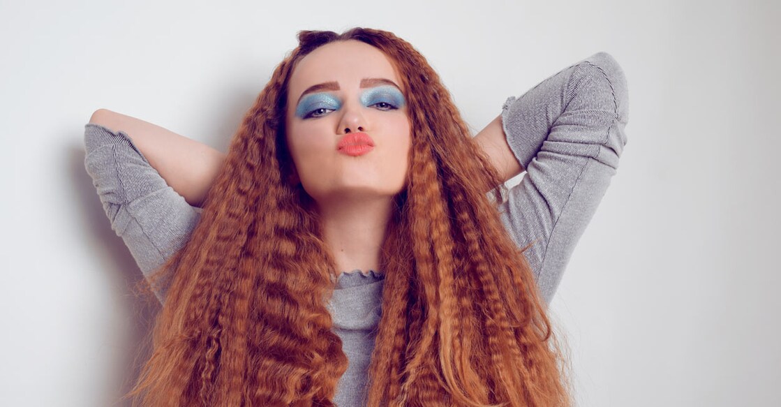 Frizzy-crimped hair can be styled in a variety of ways, ranging from 90s-inspired looks to more delicate looks : Shutterstock/More Than Production