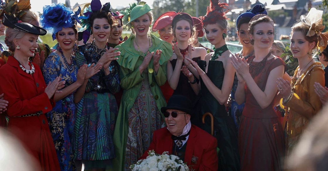 Designer Slava Zaitsev and models pose for a picture after the show during the Moscow Fashion Week in Moscow, Russia. Reuters/Evgenia Novozhenina/File Photo