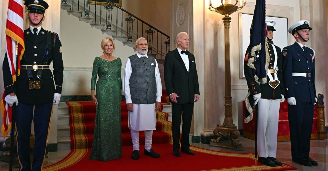 US President Joe Biden (R) and First Lady Jill Biden (L) pose for pictures with India's Prime Minister Narendra Modi at the Grand Staircase of the White House before a State Dinner in Washington, DC. Photo: Andrew Caballero-Reynolds / AFP