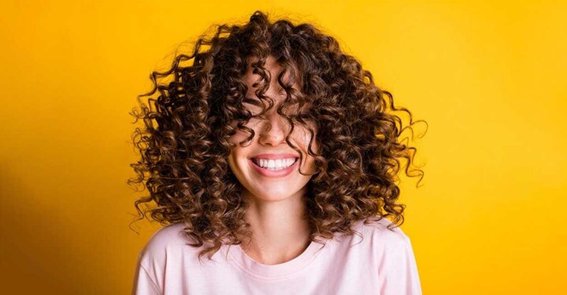 Curly hair is always a delight to watch, but to maintain. Photo: Roman Samborskyi/Shutterstock.com