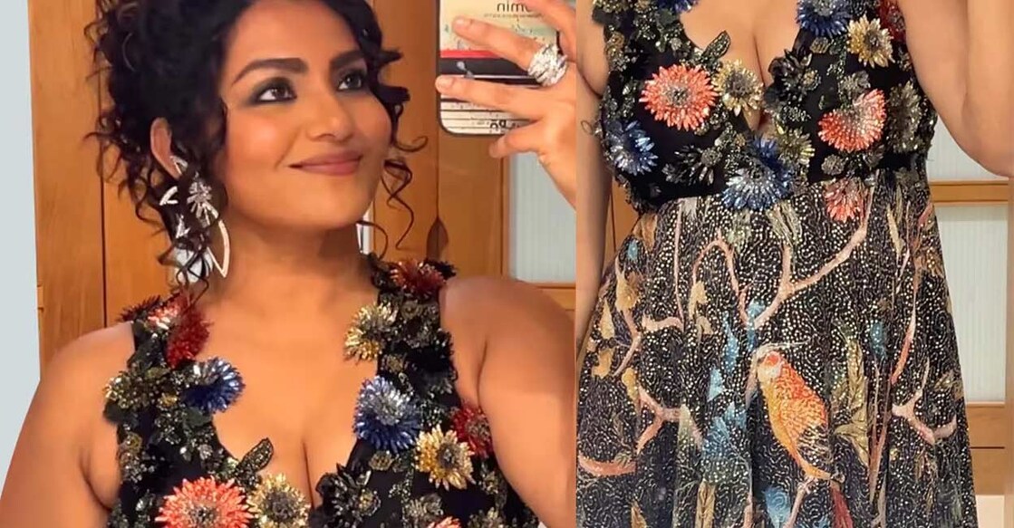 Parvathy's outfit consisted of a sleeveless heavy work black frock with floral glitter. Photo: instagram.com/par_vathy