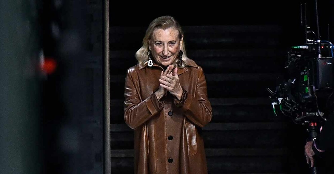 Head designer and creative director of Prada group, Miuccia Bianchi Prada acknowledges the audience at the end of her show as part of the Paris Fashion Week Womenswear Spring/Summer 2024. Photo: JULIEN DE ROSA / AFP