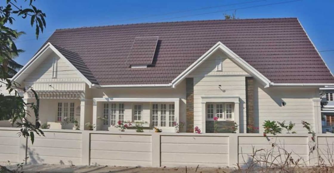 This exotic colonial style house in Muvattupuzha is elegantly charming