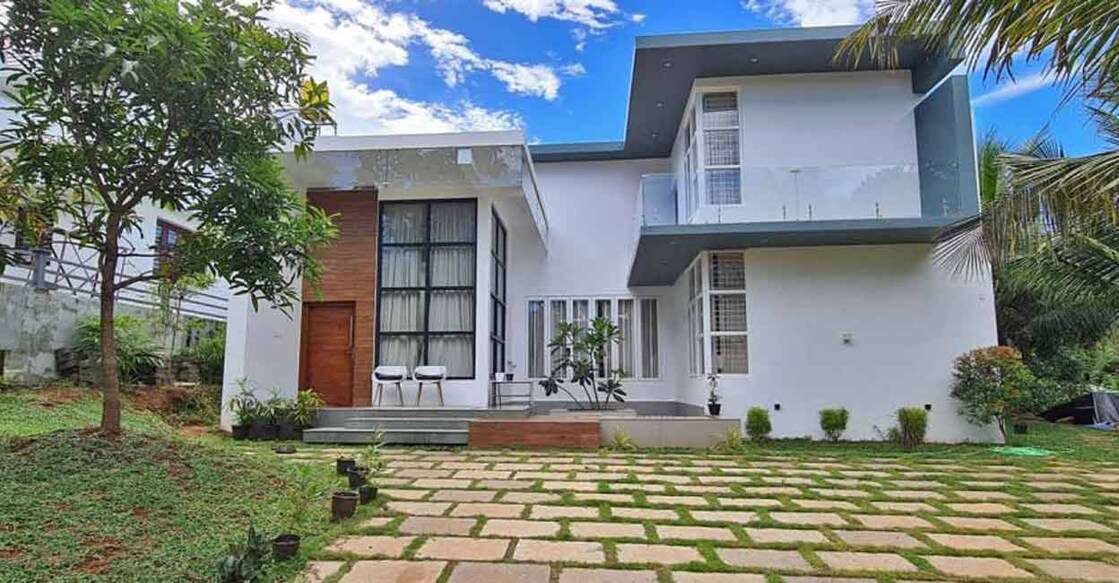 The beautiful courtyard is the highlight of the exteriors of this house in Malappuram.