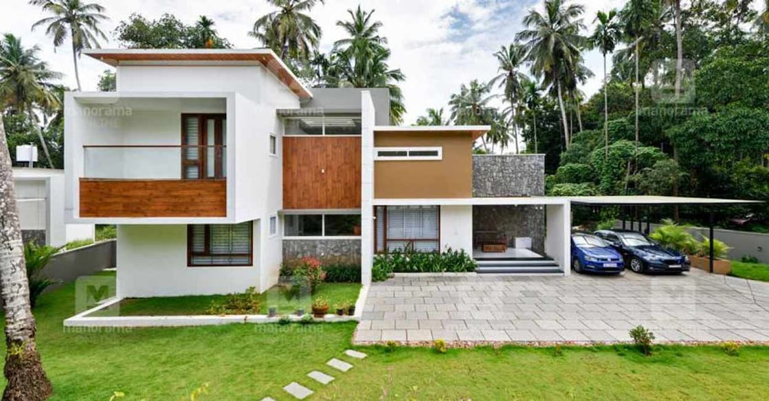 The Fundermax wooden panelling and the show wall with rock claddings make the house incredibly attractive.