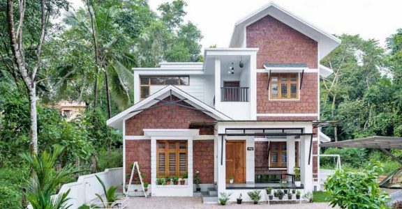 Low cost house design with sloped roof porch