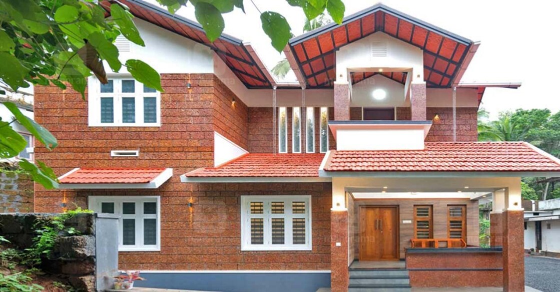 The rustic charm of laterite stones is the highlight of the elevation. 
