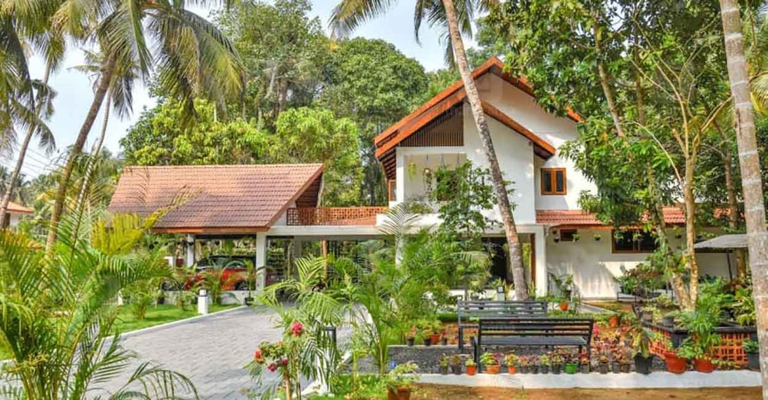 House in kodungallur GI truss roof has been newly installed over the old slanting roof in this renovated house.