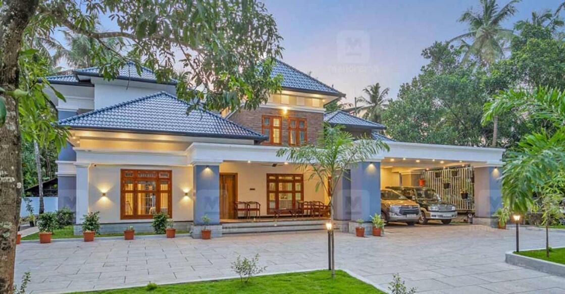 The multi-tiered roof enhances the elevation of the house.
