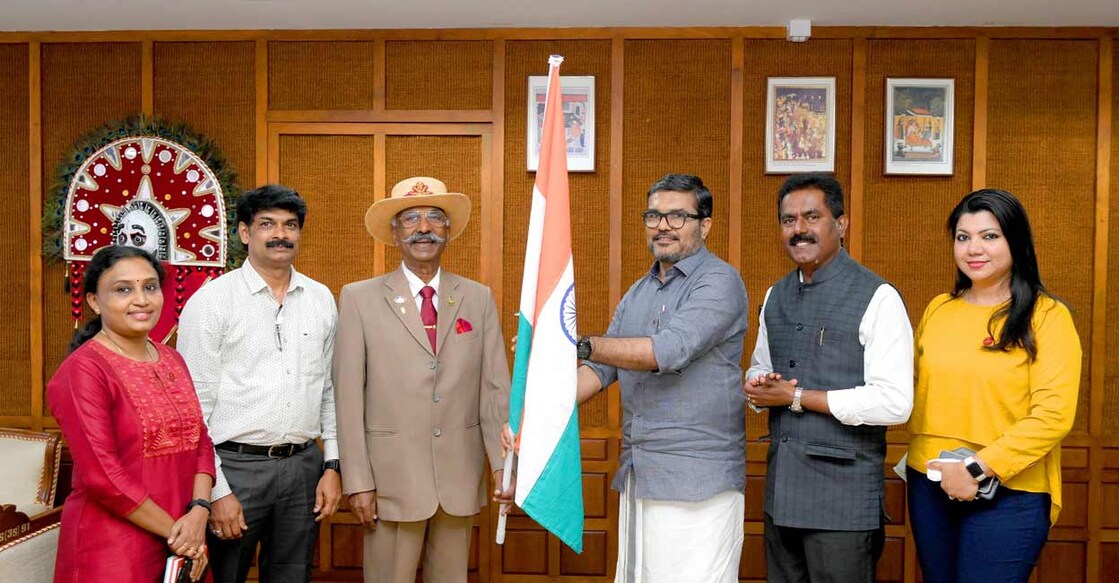 Speaker M B Rajesh inaugurates the campaign by handing over a flag kit to Major General T M John. Asset Homes MD, Sunil Kumar V, Chief Marketing Officer, Sajeem S, Head, Customer Care Indu Rajesh, GM – Marketing Malini P Nair are also seen. Photo: Special arrangement