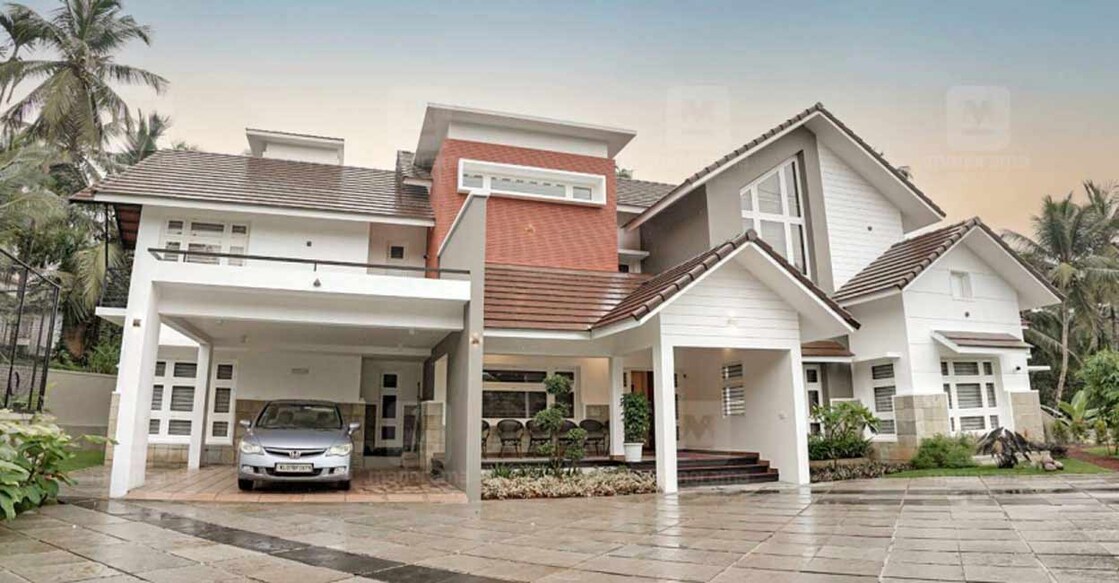 Slope roof in multiple layers is the highlight of the elevation.