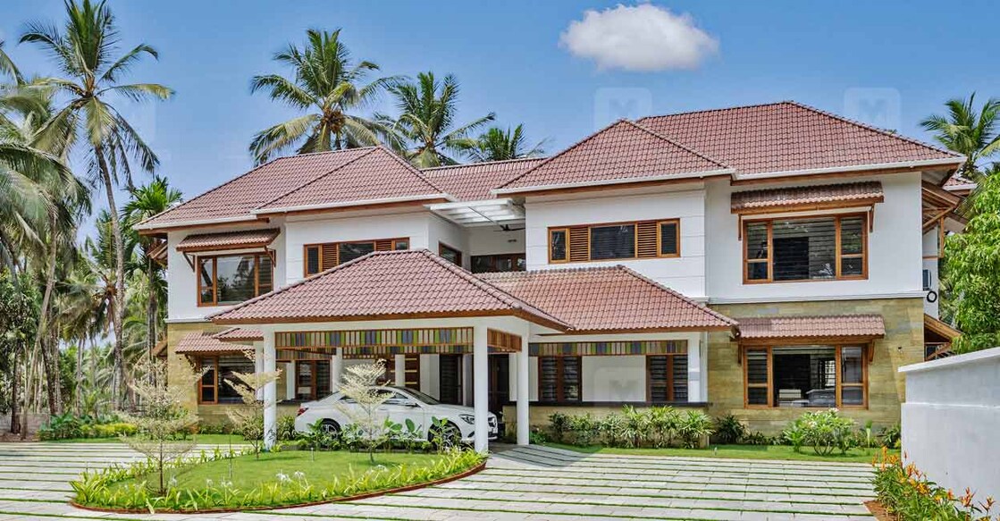 Truss roof has been installed over the flat roof and is then paved with roofing tiles.