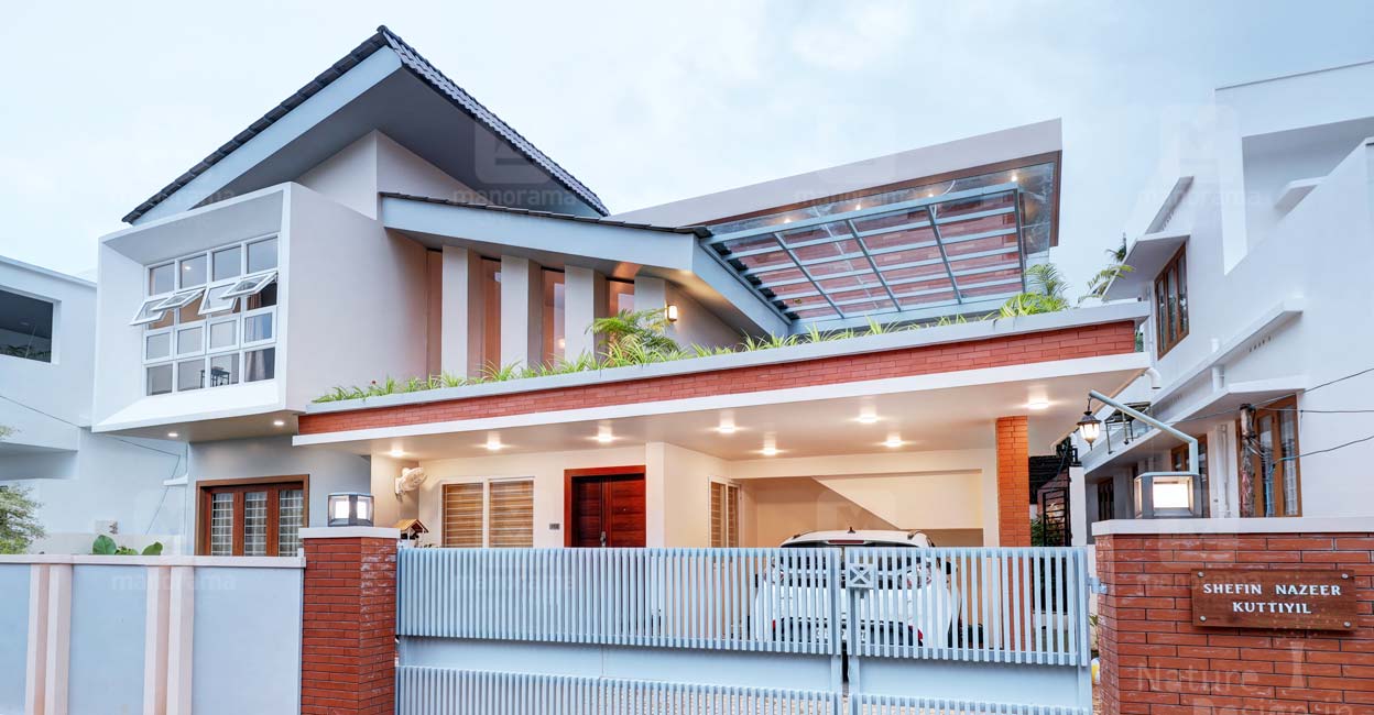 The slanting roof in multiple layers, the open balcony and the designer cladding work on the walls are the highlights of the elevation. 