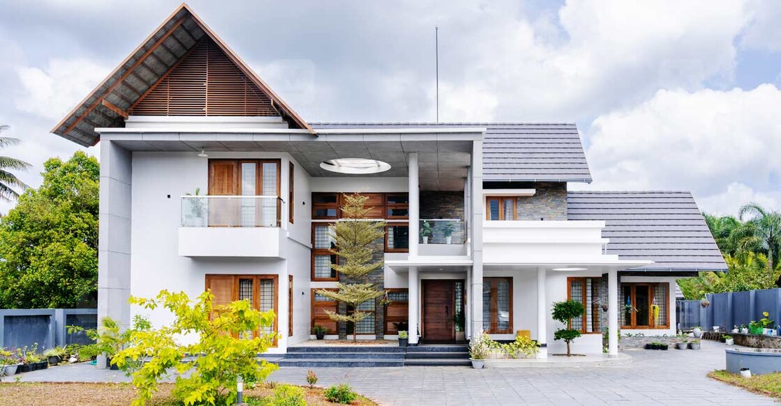 Double height concrete pillars and windows add panache to the exteriors. Photo special arrangement