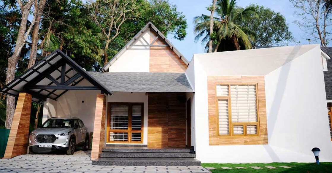 Truss roofing the double-height ceiling helps in reducing the heat inside the house. Photo: Ajith