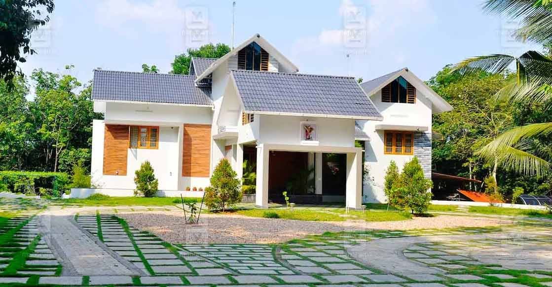 kanjirapally-house-c-01 The elevation breaks away from the conventional 'box' pattern with its distinctive slanted, multi-level roofing. Photo: Special arrangement