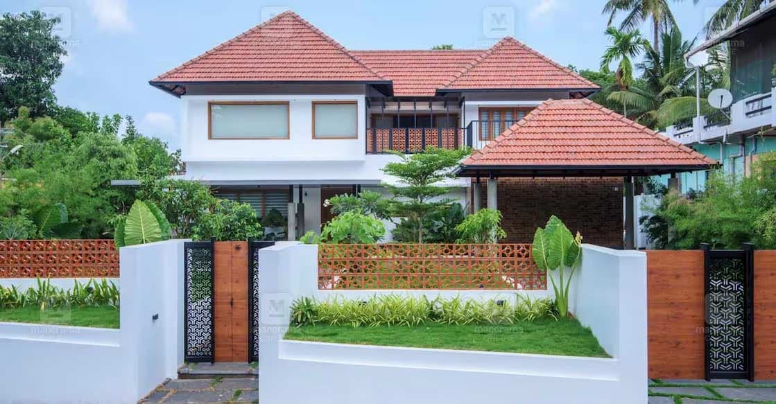 thrissur-house-1-c The house features a graceful truss roofing design that seamlessly extends to the car porch, maintaining a uniform style throughout. Photo: Special arrangement