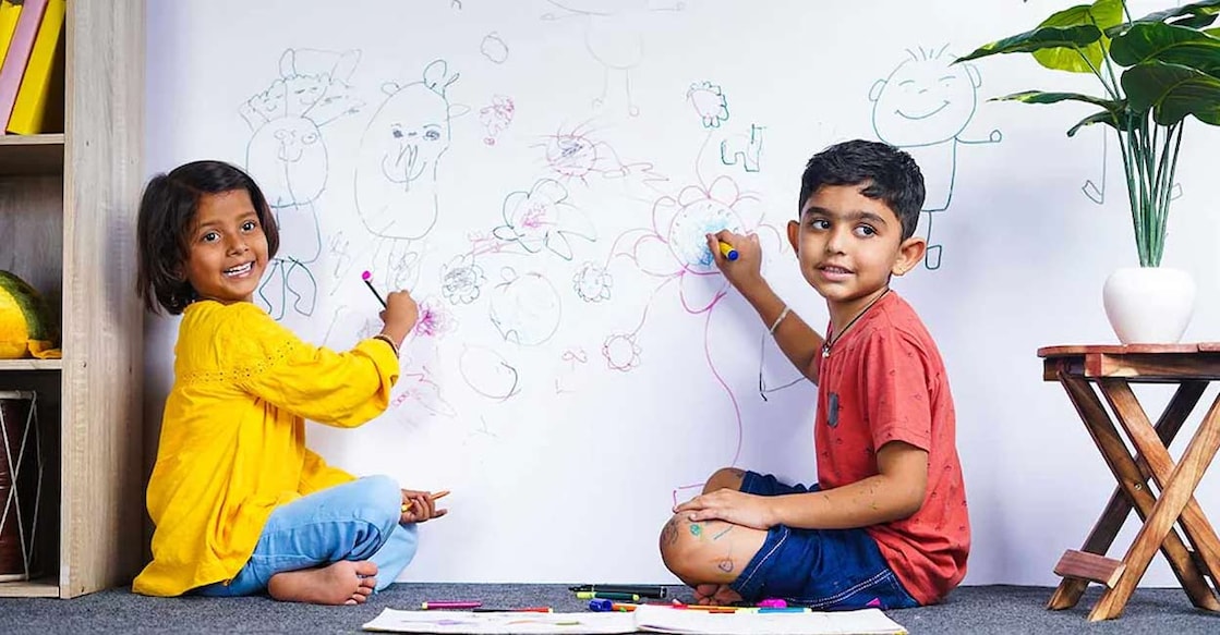 kids--wall-art-c Children may scribble on walls using coloured pens and pencils even before they learn to write. Photo: WESTOCK PRODUCTIONS/ Shutterstock.com.