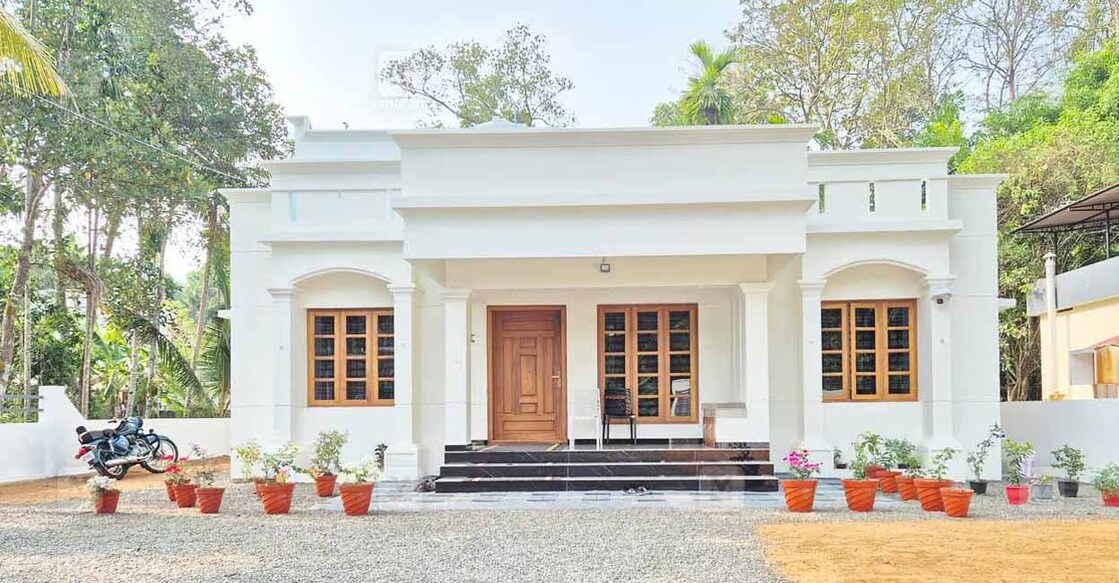The standard box-type elevation of the house perfectly fits the 21-cent rectangular plot. Special arrangement