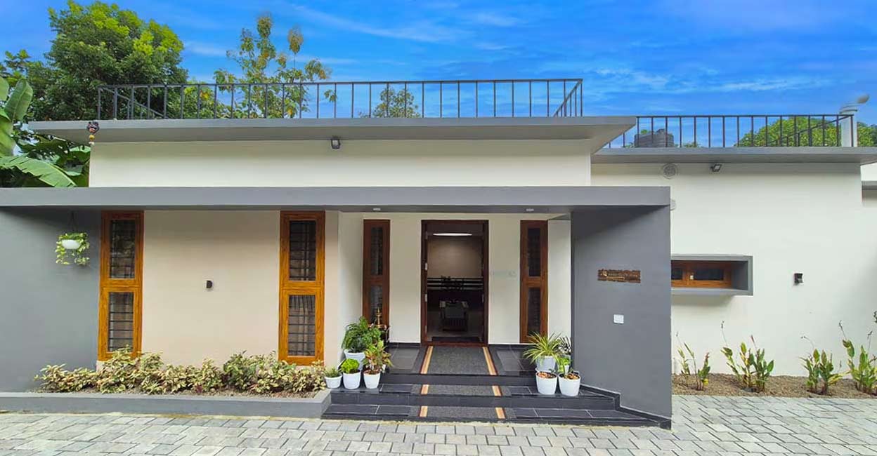 pathanamthitta-house-01-c The contemporary house, with a wide elevation, suits the layout of the plot. Photo: Ajith