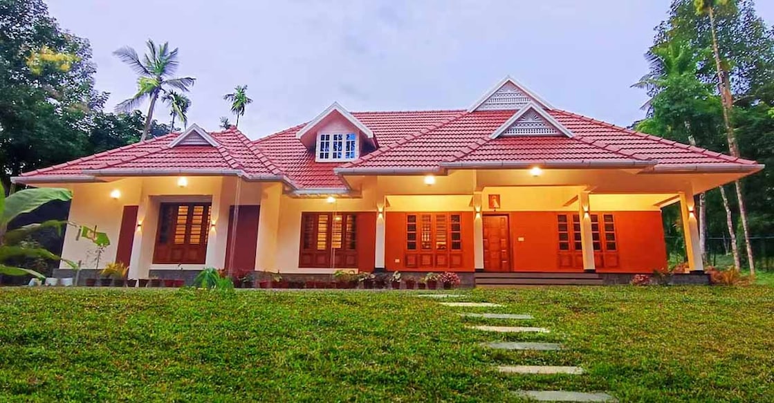 Truss roof is installed above flat roof and is completed by paving clay tiles. Photo: Special arrangement