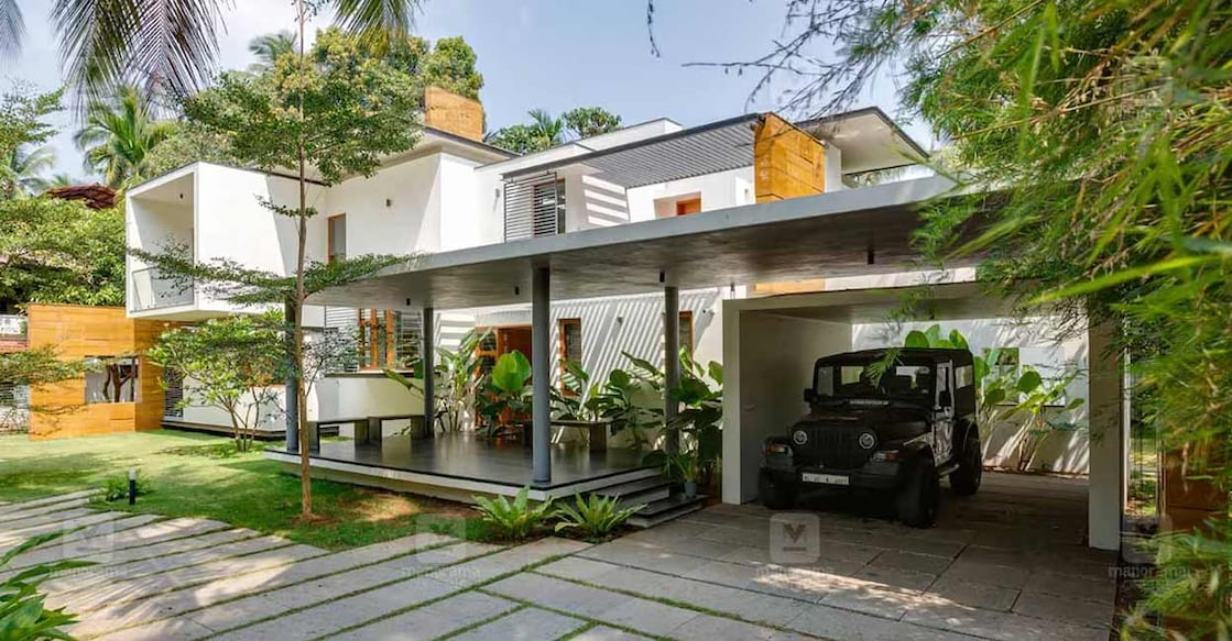 thrissur-home-01-c The elevation is quite simple as the house is concealed behind thick foliage and greenery. Photo: Special arrangement