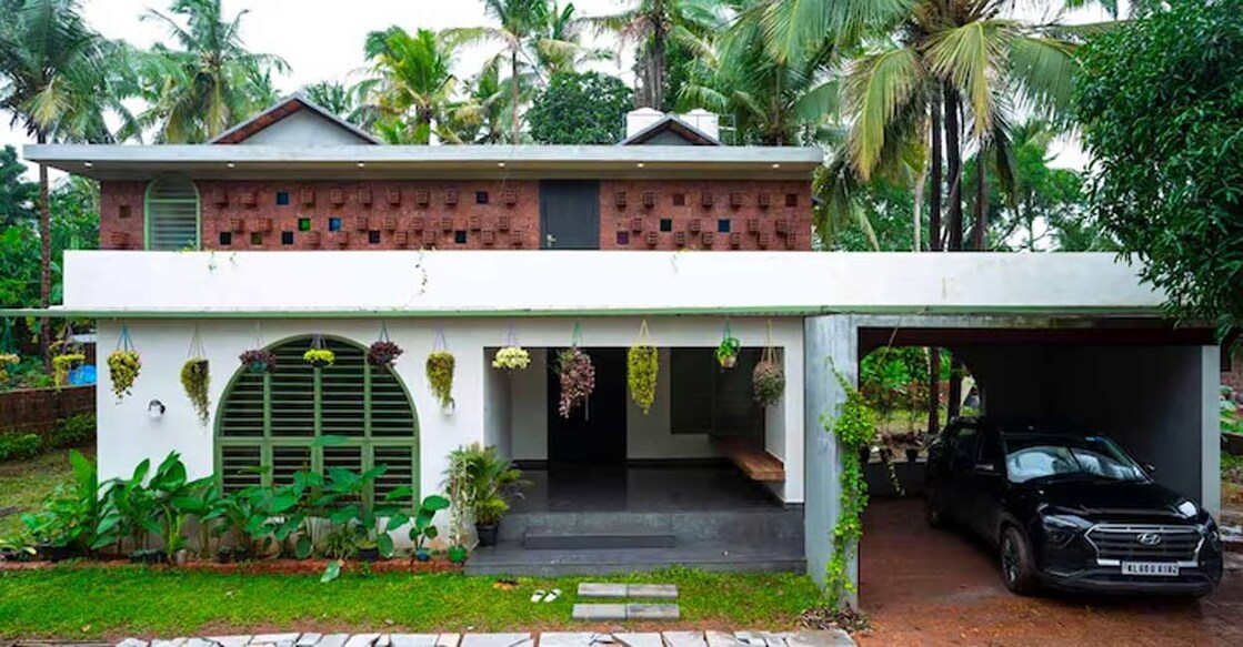 The front side of the house has a flat roof while GI truss roof has been installed on the backside. Special arrangement