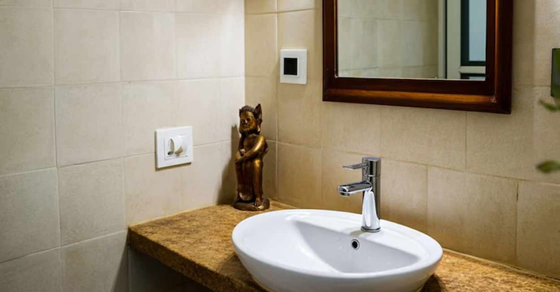 Besides the drain where water flows out, a small hole can be seen anywhere on the washbasin. AI-generated image