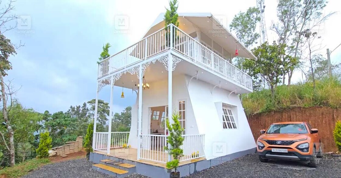 The house features an Athamkudi tile-laid sit-out and an aluminium-framed glass front door leading to a minimal interior. Photo: Special arrangement