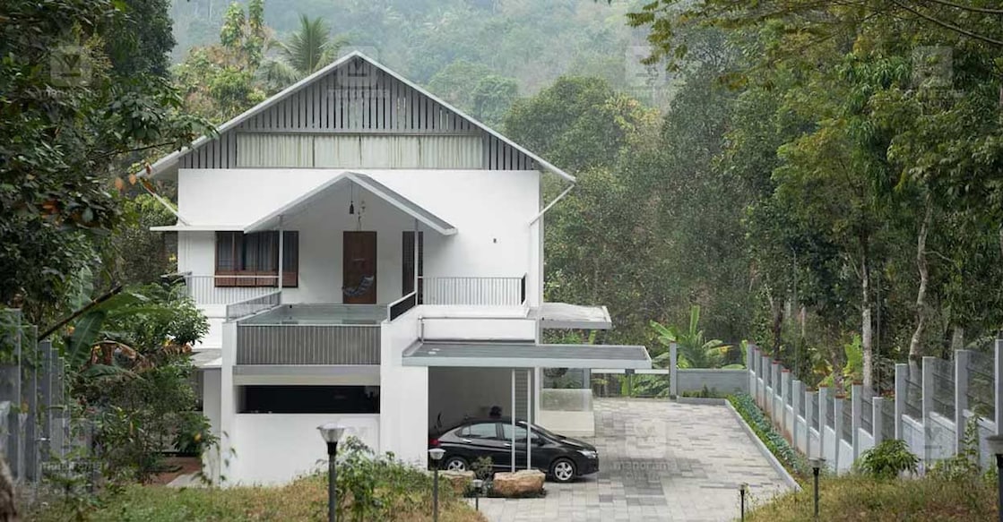 Swimming pool and double-height living room the highlights of this uniquely designed house. Photo: Special arrangement