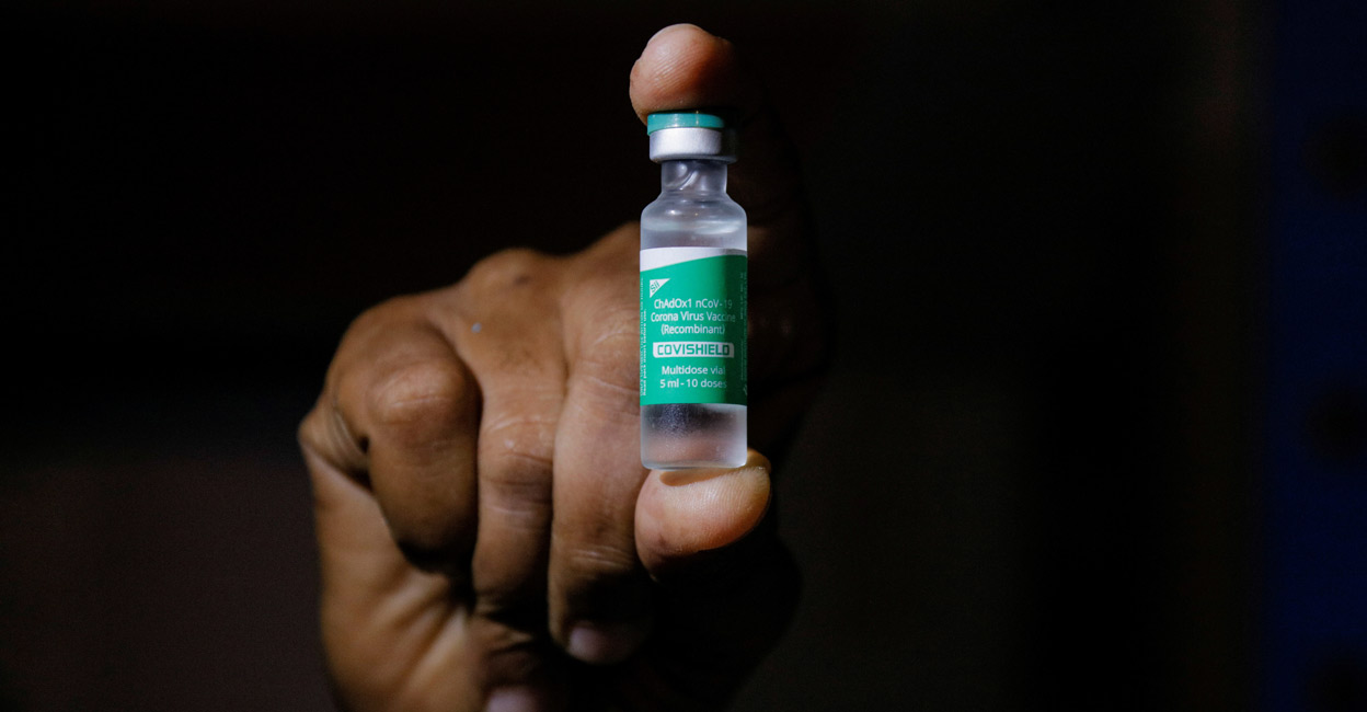 HEALTH-CORONAVIRUS-AFRICA A man displays a vial AstraZeneca's COVISHIELD vaccine. File photo: Reuters/Francis Kokoroko