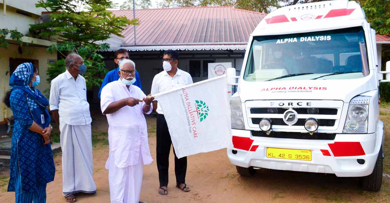 Naraynan Master from Nattika, a family member of one of the patients who avail the free dialysis service of Alpha Palliative Care, flags off the first vehicle for the free transportation of dialysis patients in Edamuttom.