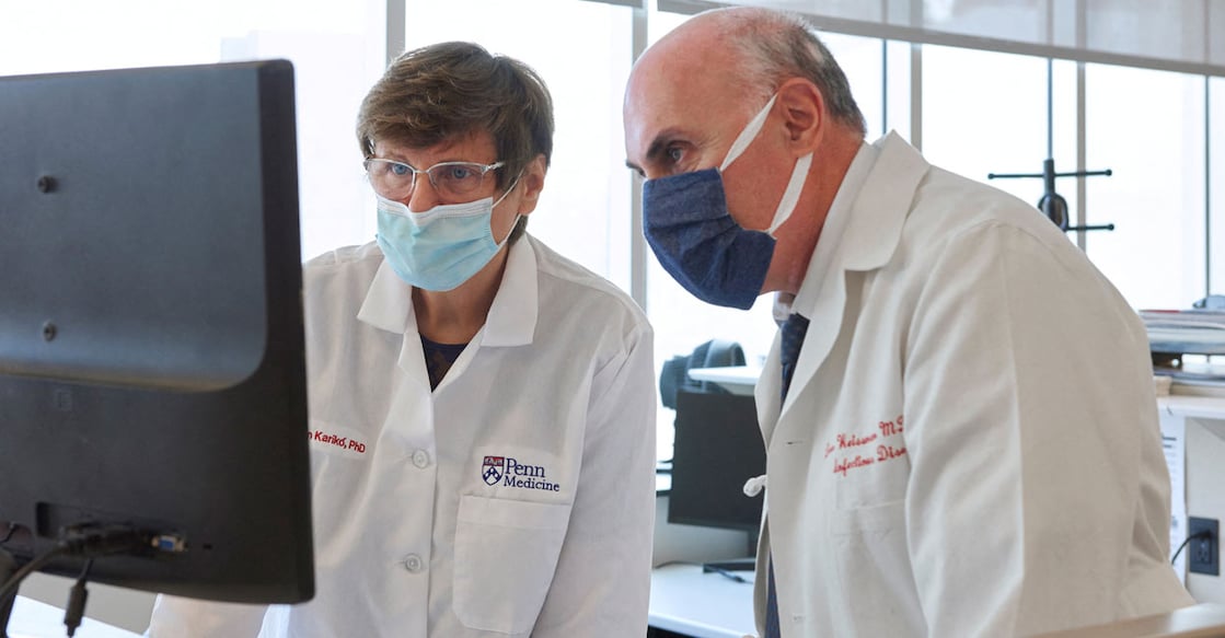 Penn Medicine scientists Katalin Kariko and Drew Weissman look at a computer monitor in an undated photograph at the University of Pennsylvania in Philadelphia. Photo: US Peggy Peterson Photography/Penn Medicine/Handout via Reuters/File