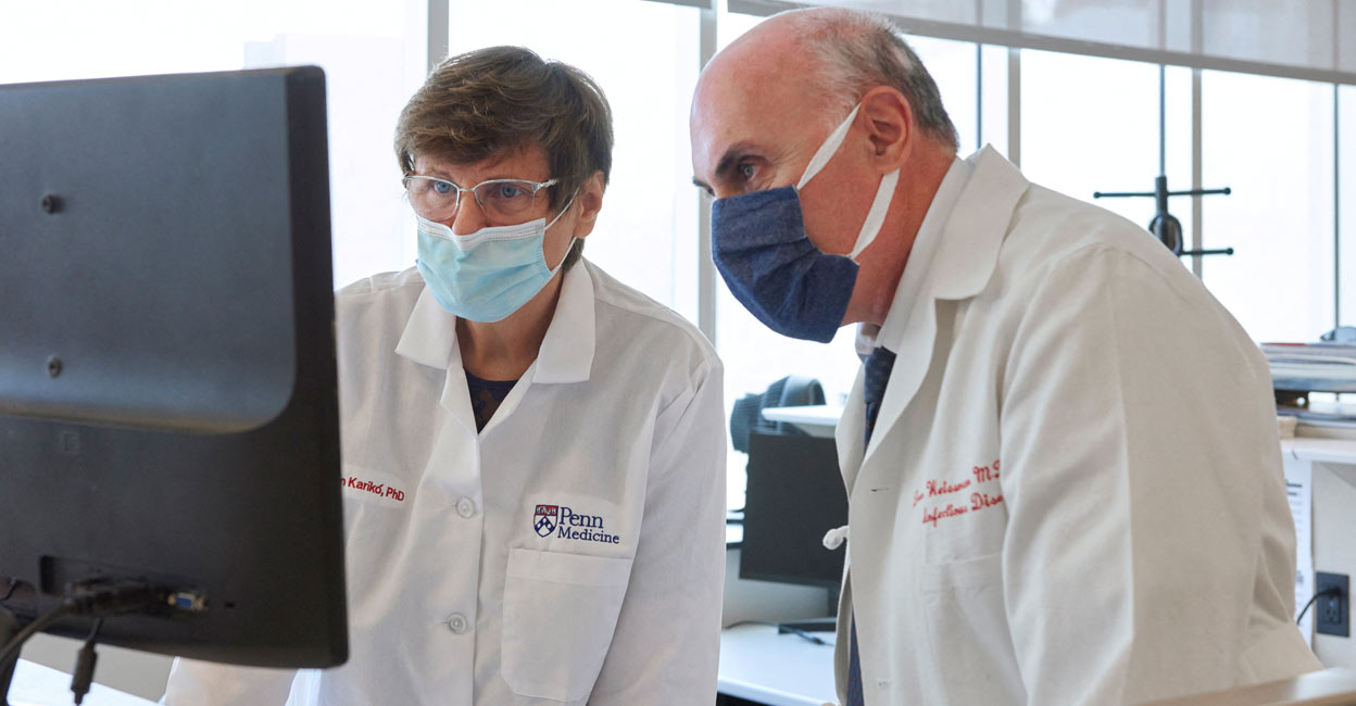Penn Medicine scientists Katalin Kariko and Drew Weissman look at a computer monitor in an undated photograph at the University of Pennsylvania in Philadelphia. Photo: US Peggy Peterson Photography/Penn Medicine/Handout via Reuters/File