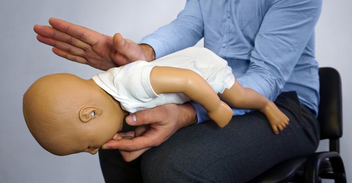 Heimlich maneuver is a process that can be applied when a baby chokes after putting a thing in its mouth. Michael Pervak / Shutterstock