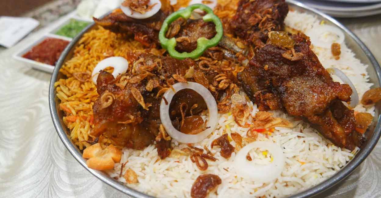 mandi To prepare mandi, rice is slow-cooked in the marinated meat stock immersed in a clay pit. Photo: Shutterstock/msalbarid93
